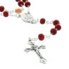 Rose-scented rosary in a glass bottle