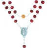Rose-scented rosary in a glass bottle
