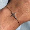 Gold-plated bracelet with a central cross decorated with rhinestones