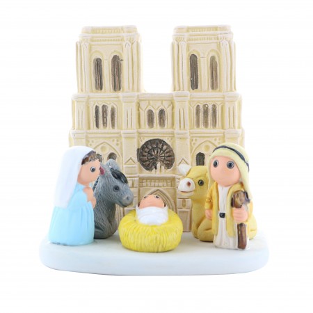 Christmas cot with Notre Dame de Paris cathedral in ceramic