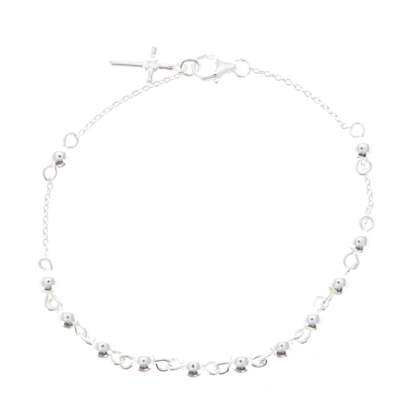 Silver tenner bracelet with a cross