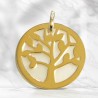 Gold tree of life medal on a mother of pearl background
