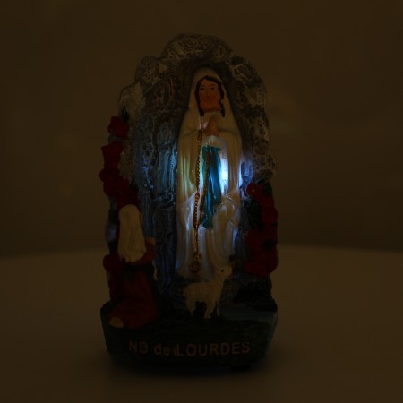 Statue with light of the Grotto of Lourdes