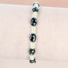 Black and pearly beads bracelet with Lourdes medal