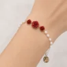 Braccialetto “dizainier” di Santa Rita con perline e rose rosse